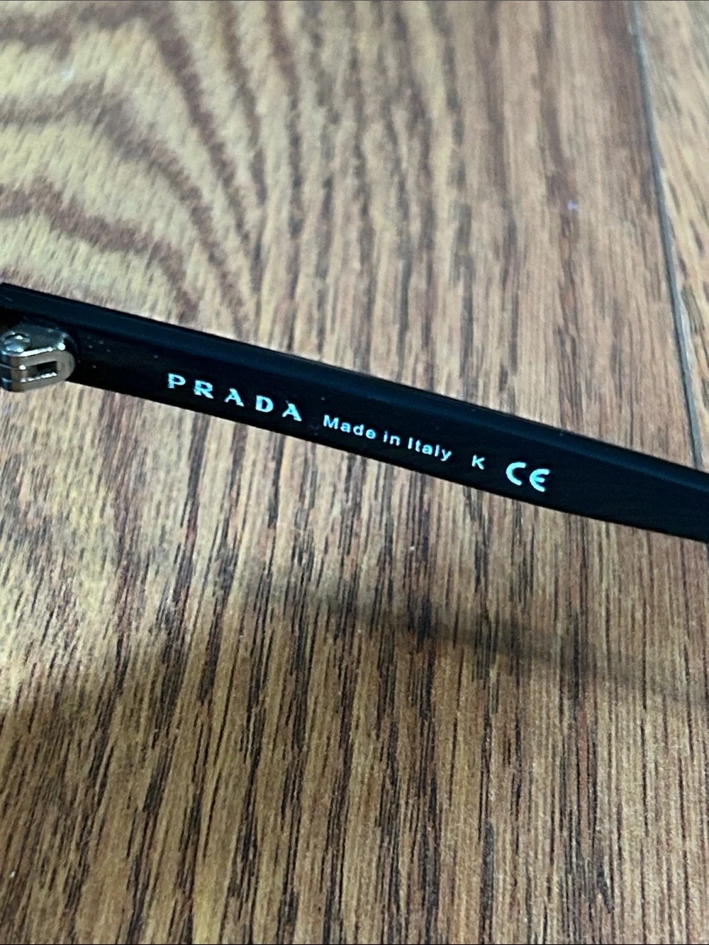 Prada SPR 16S 57-16 1AB-1A1 140 3N Cat-Eye Glossy Sunglasses -